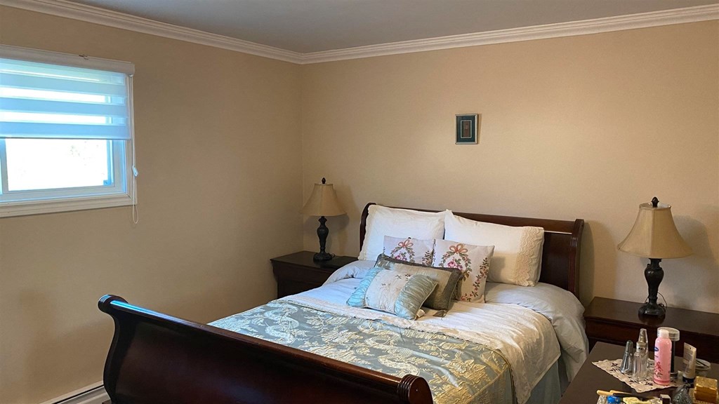 a bedroom with a bed with pillows and