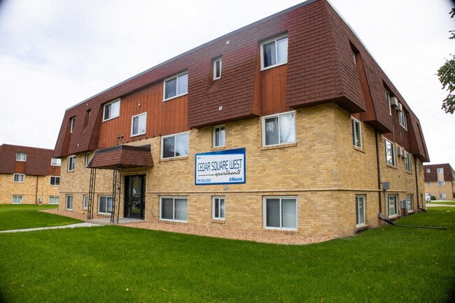 a brick building with a sign on the side of it