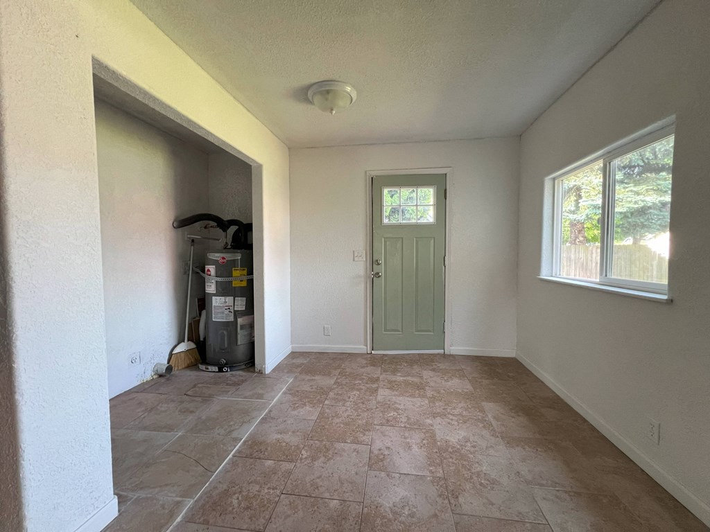 the living room of a house with a green door