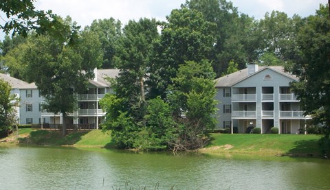 the view of the apartments from the lake
