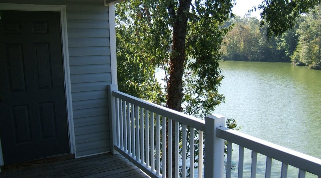 a view of the lake from the porch of a house