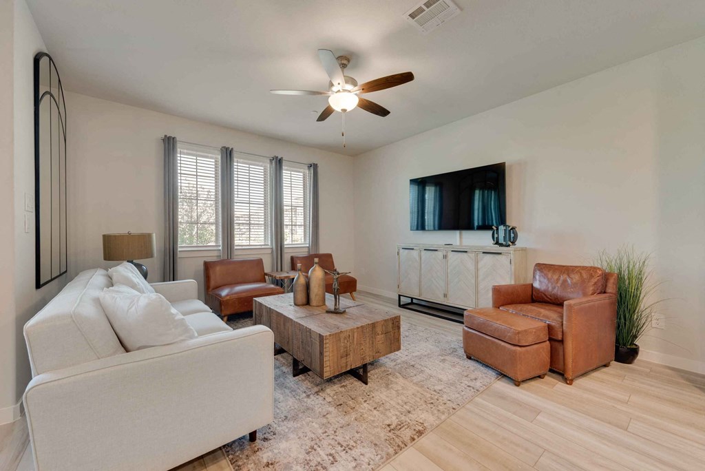 a living room with a couch and a tv