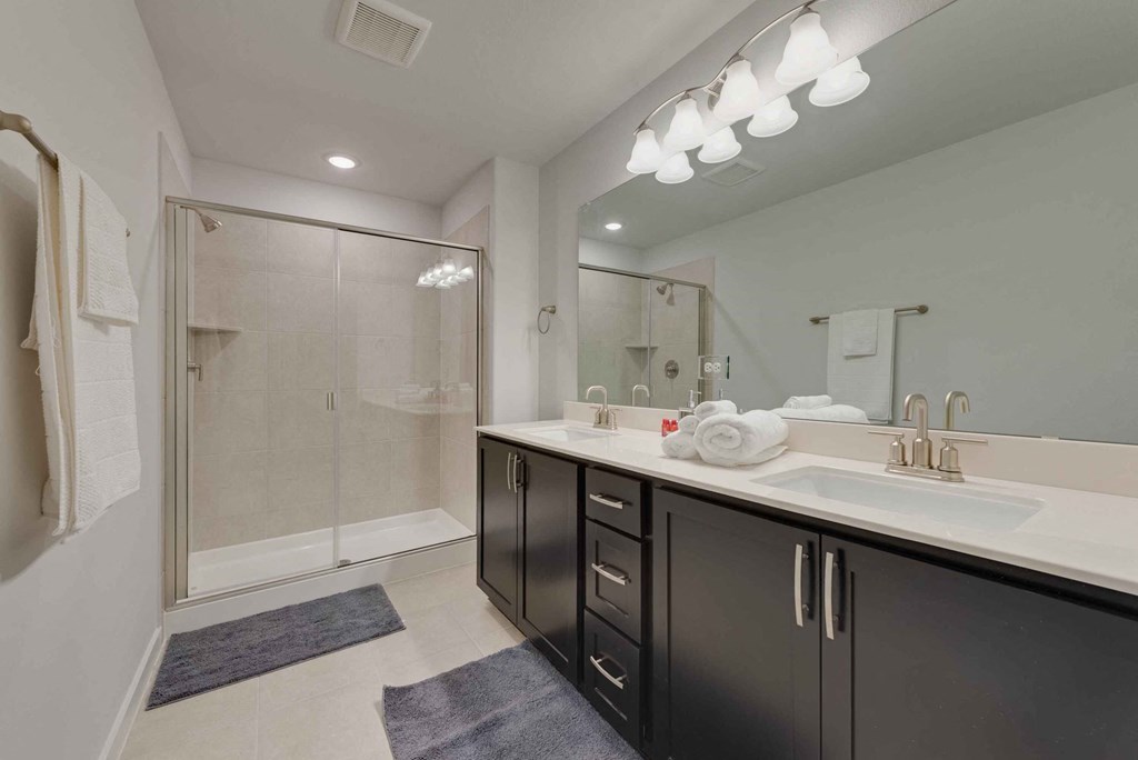a bathroom with a sink and a shower