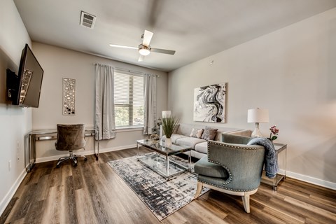 an open living room with a couch and a chair