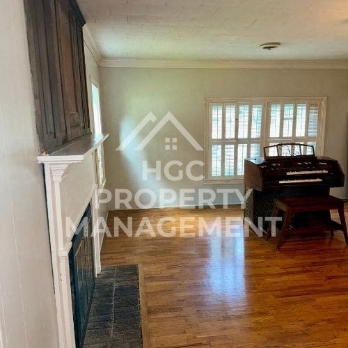 a living room with a piano in a house