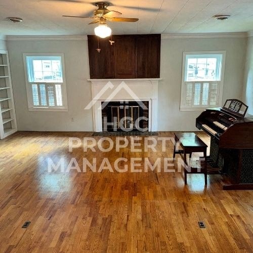 a living room with a fireplace and a piano