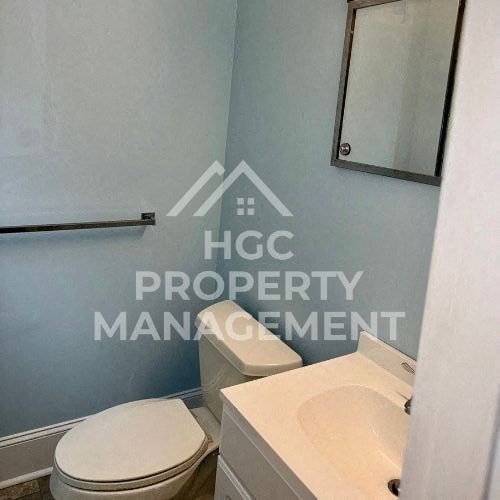 a bathroom with a toilet and a sink