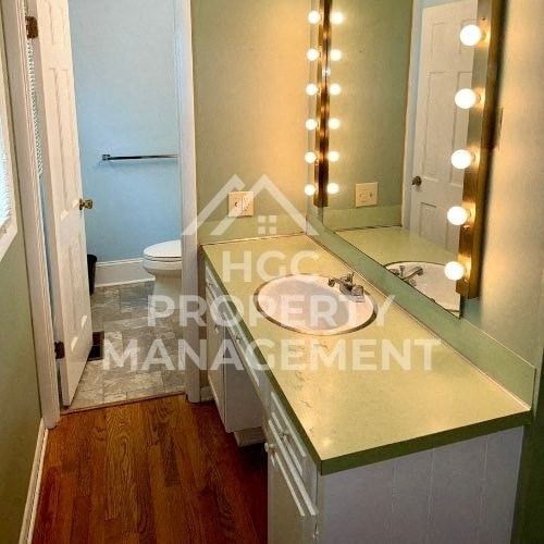 a bathroom with a mirror and a sink