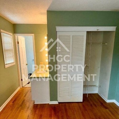 an empty room with a closet and a door