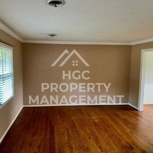 an empty room with a logo on the wall