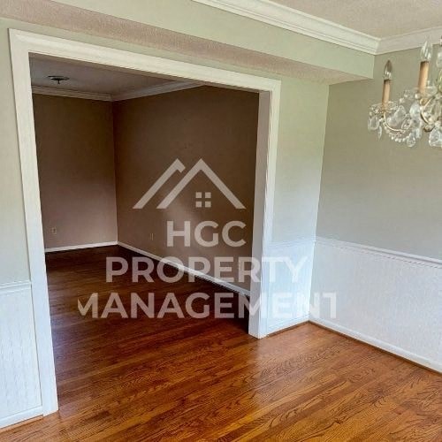 a living room with a hard wood floor and a