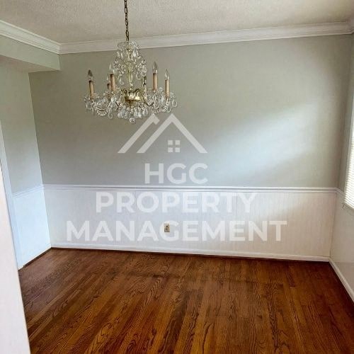 an empty room with a chandelier