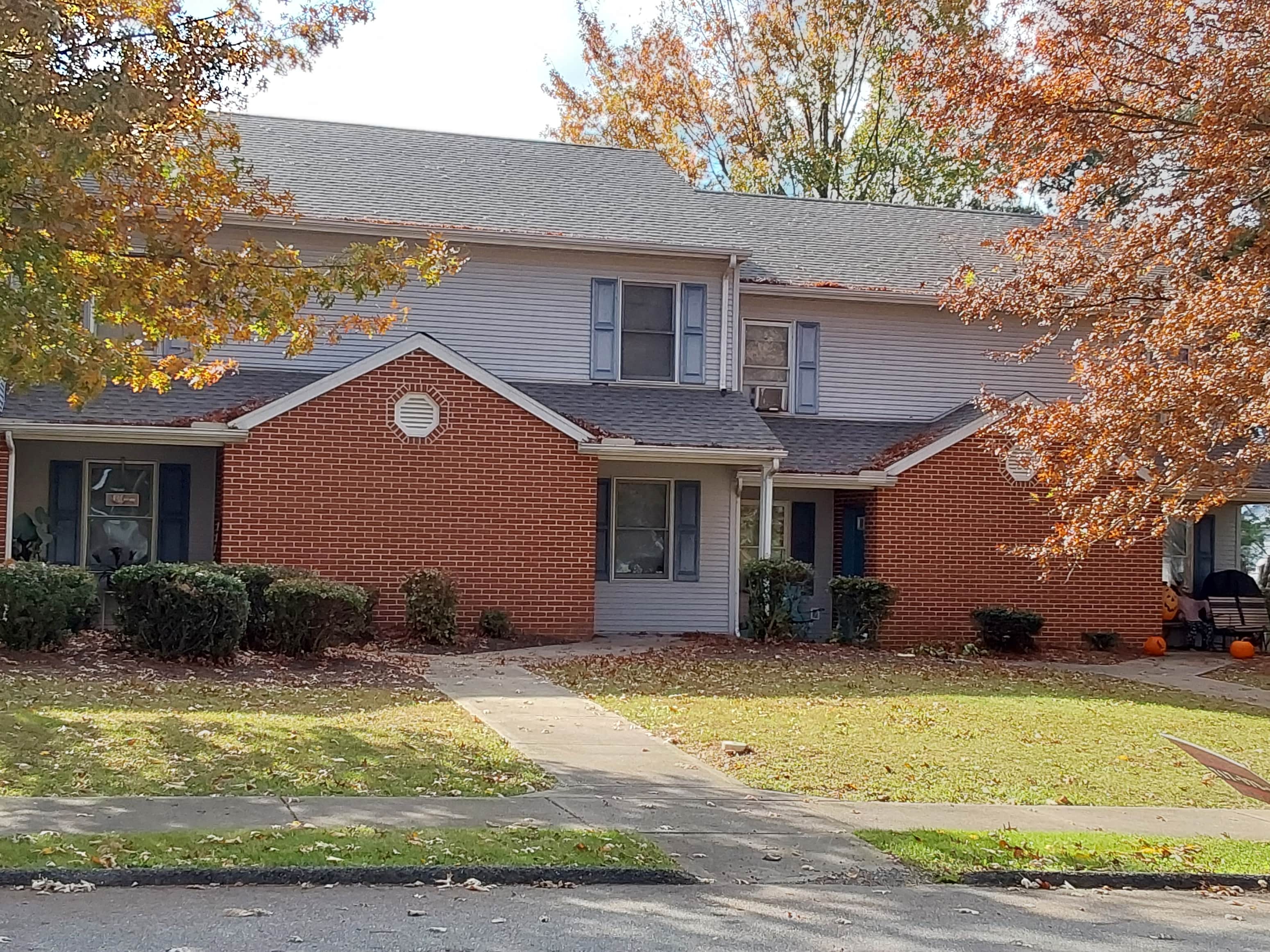 a house with a sidewalk in front of it