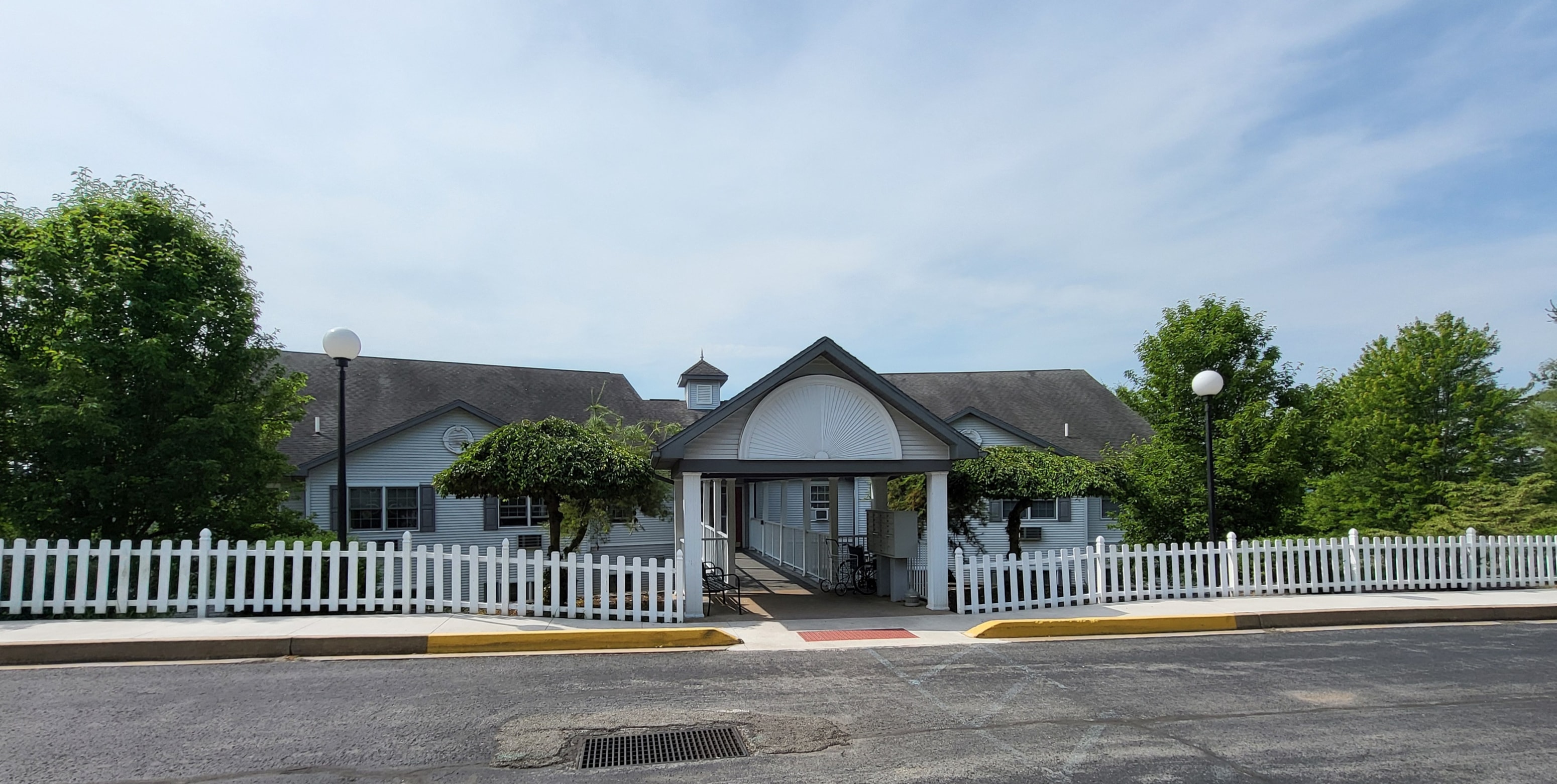 a white house with a white picket fence