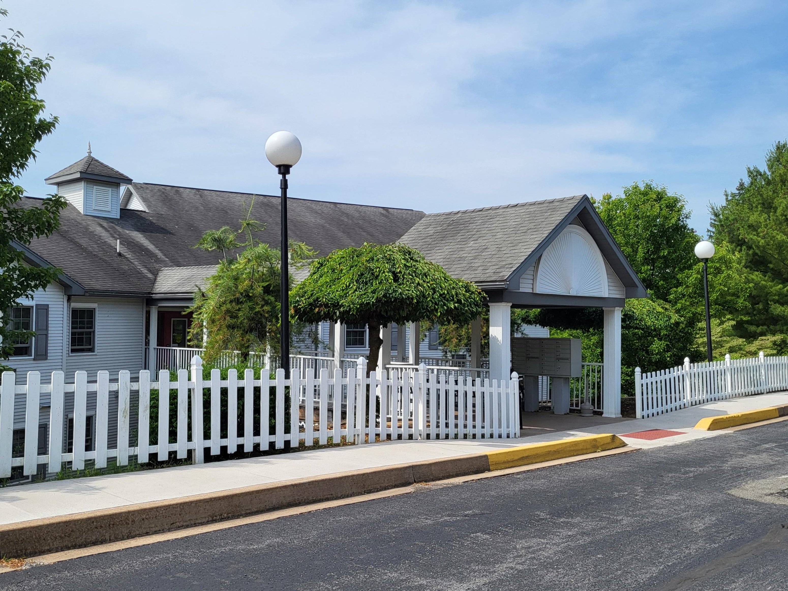 a white house with a white picket fence