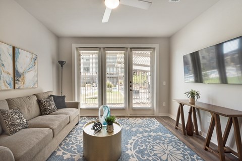 a living room with a couch and a table