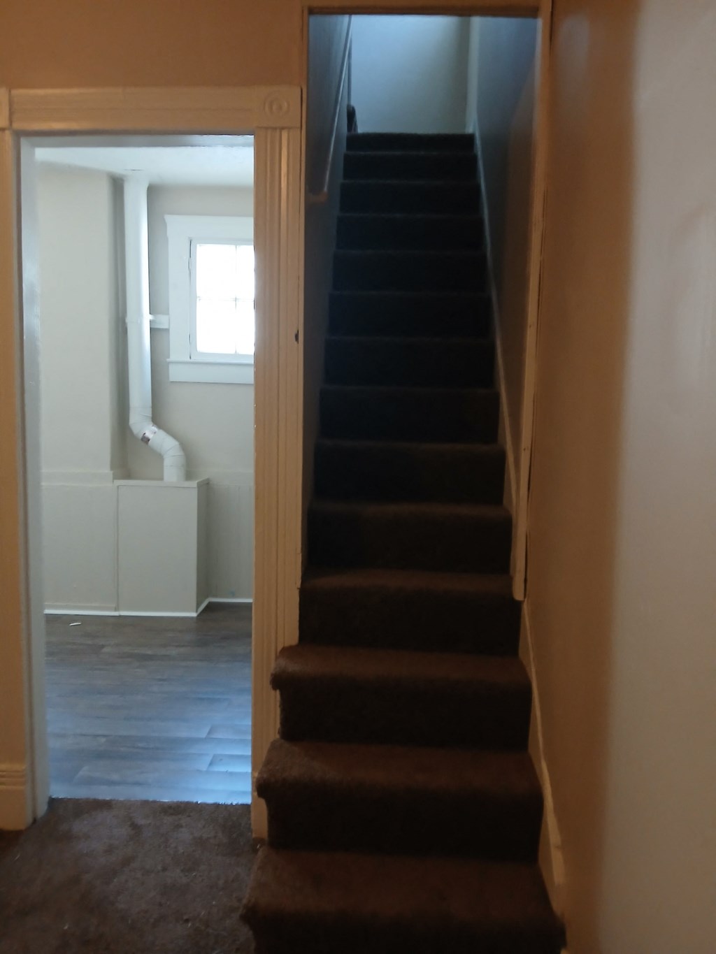 the stairs leading up to the basement in a home