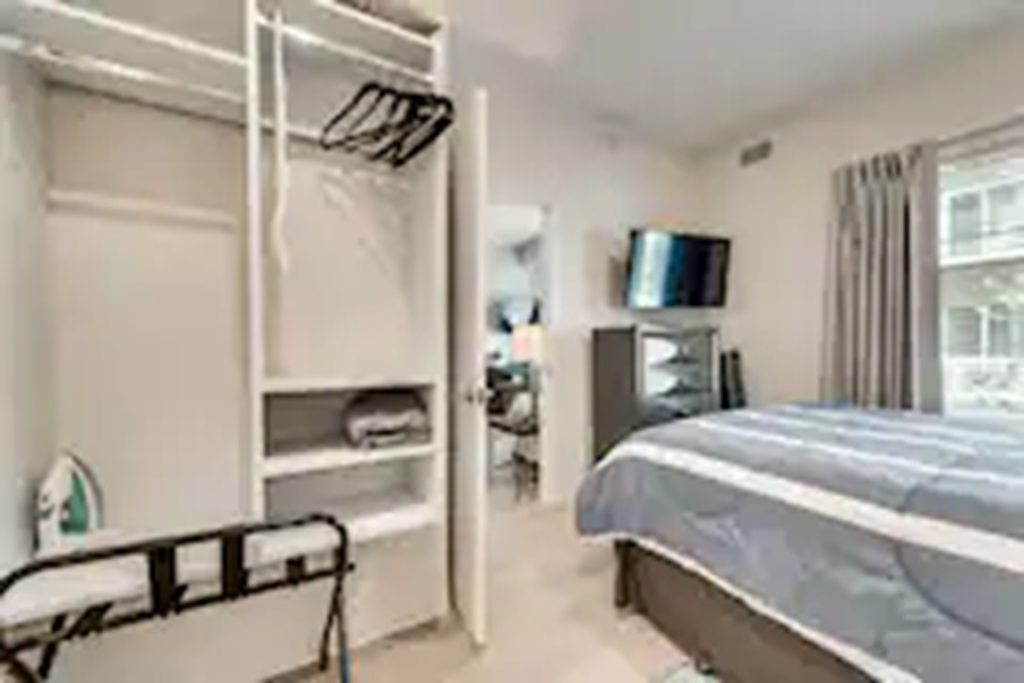 a bedroom with a bed and a closet
