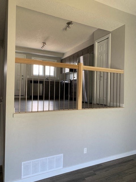 a living room with a large mirror and a railing