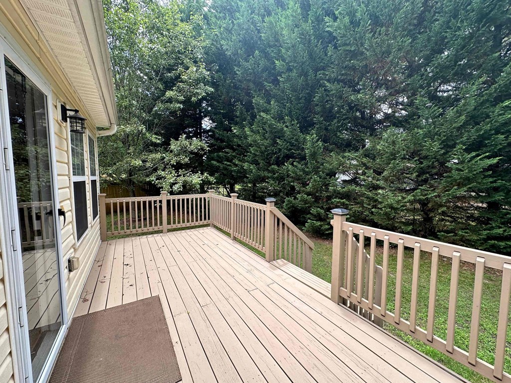 a deck with a view of the woods