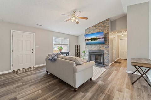 a living room with a couch and a fireplace