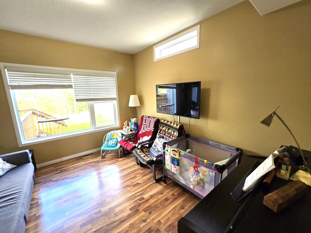 a living room with a couch and a tv