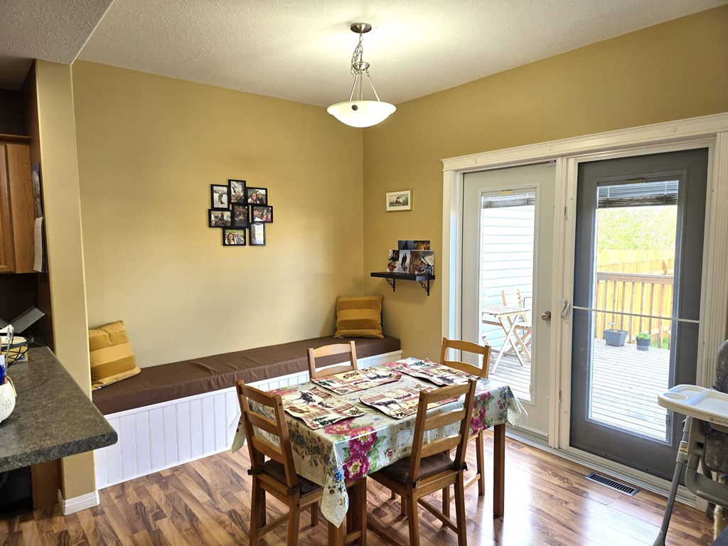 a dining room with a table and chairs