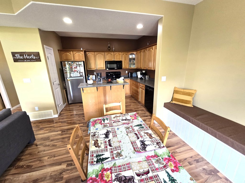 a view of the kitchen and dining area from the living room