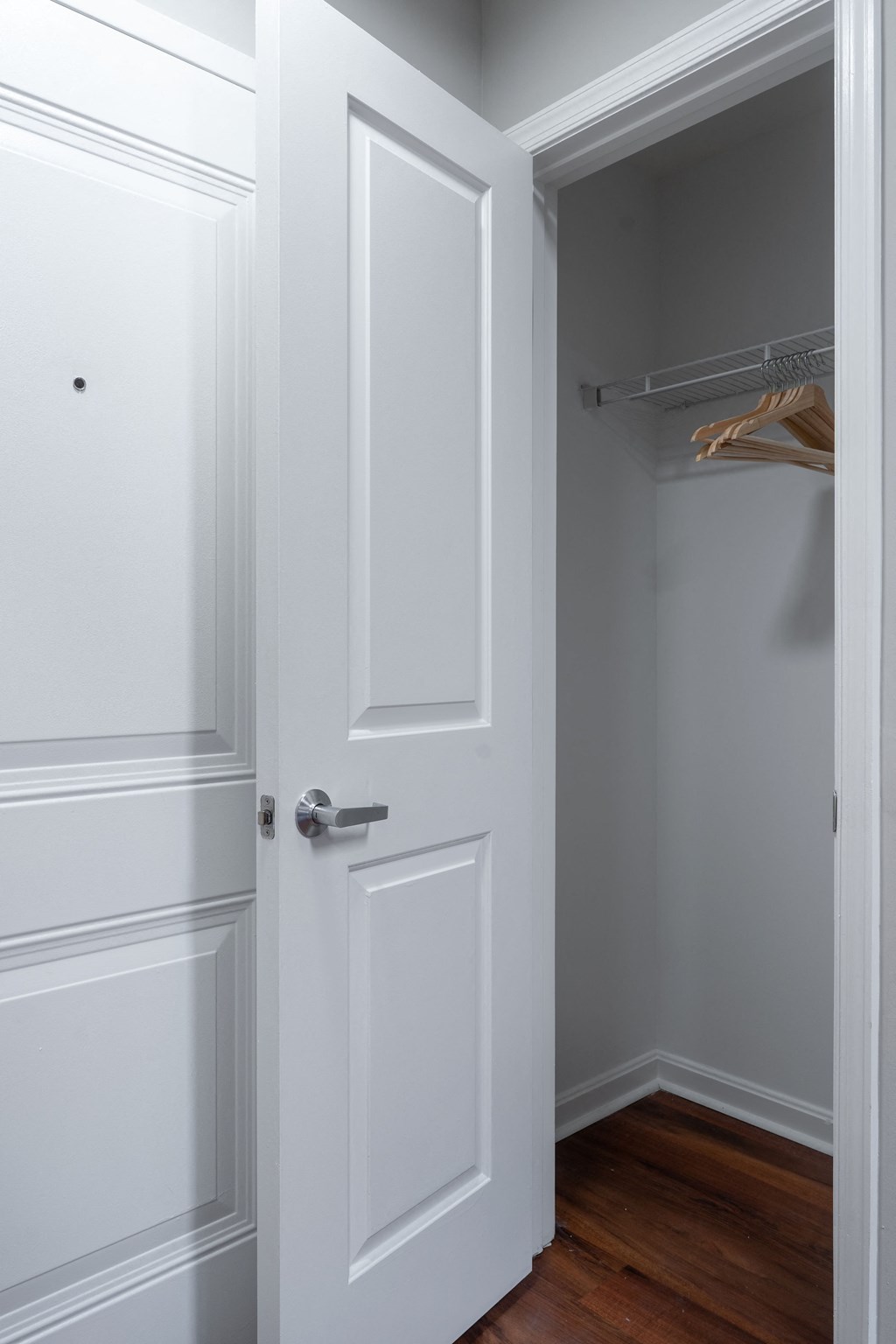 the door to the closet is open and the closet door is closed