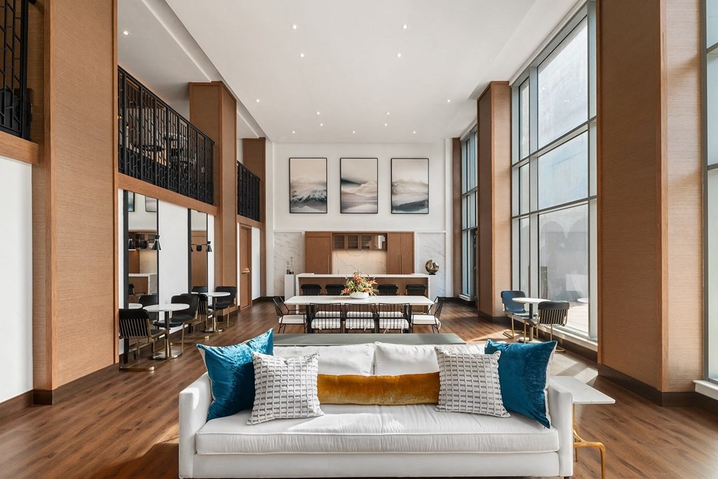 a living room with a couch and a table in the middle