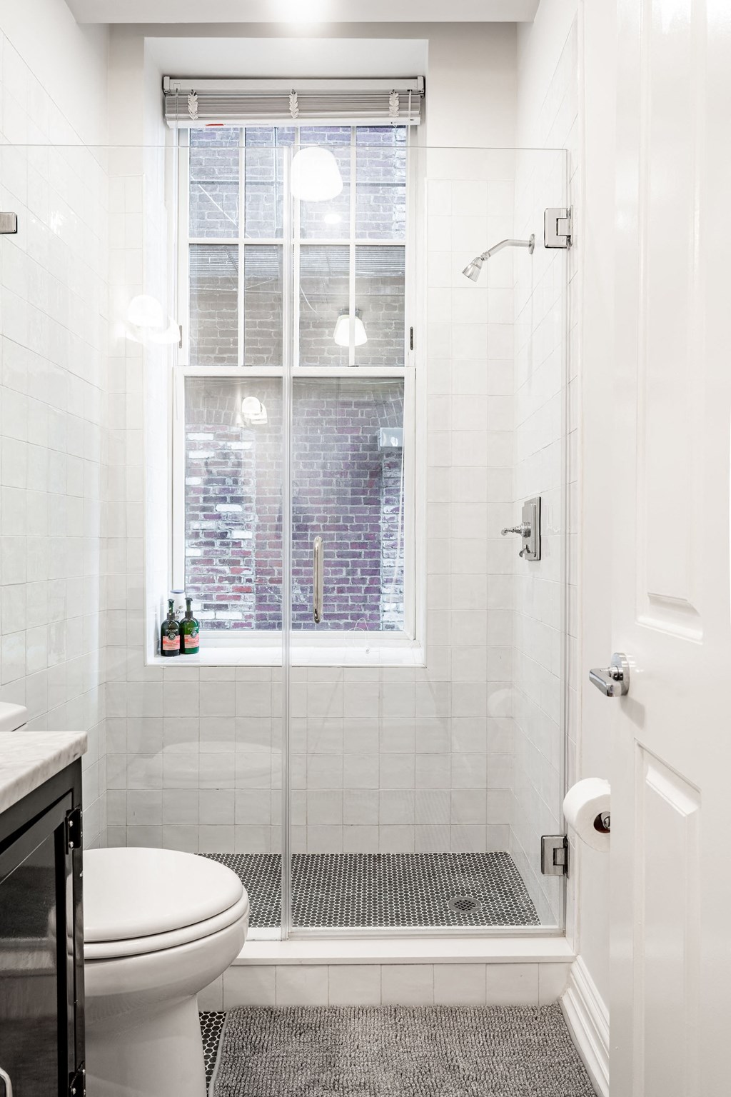 a small bathroom with a shower and a toilet