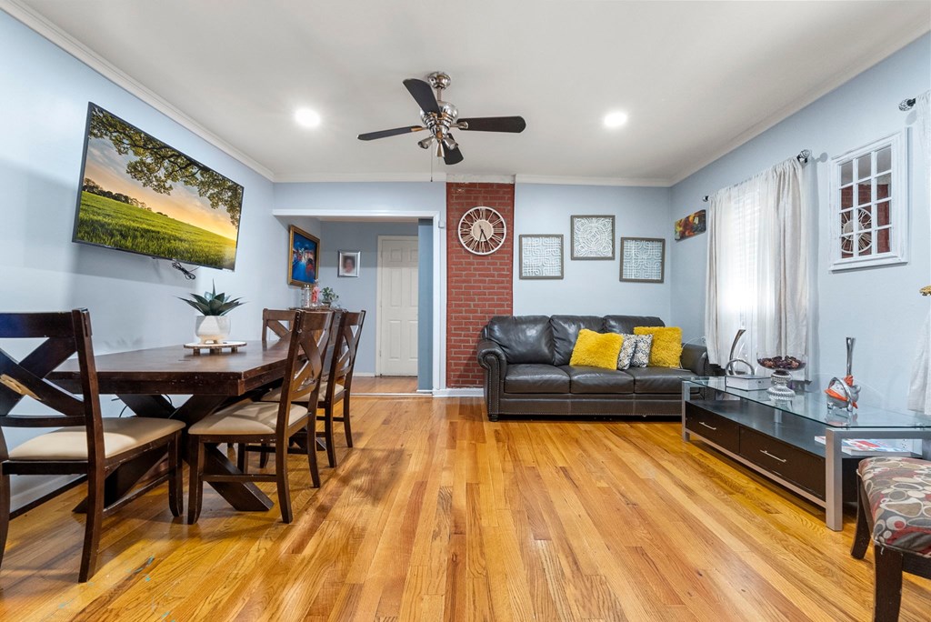 a living room and dining room with a couch and a table