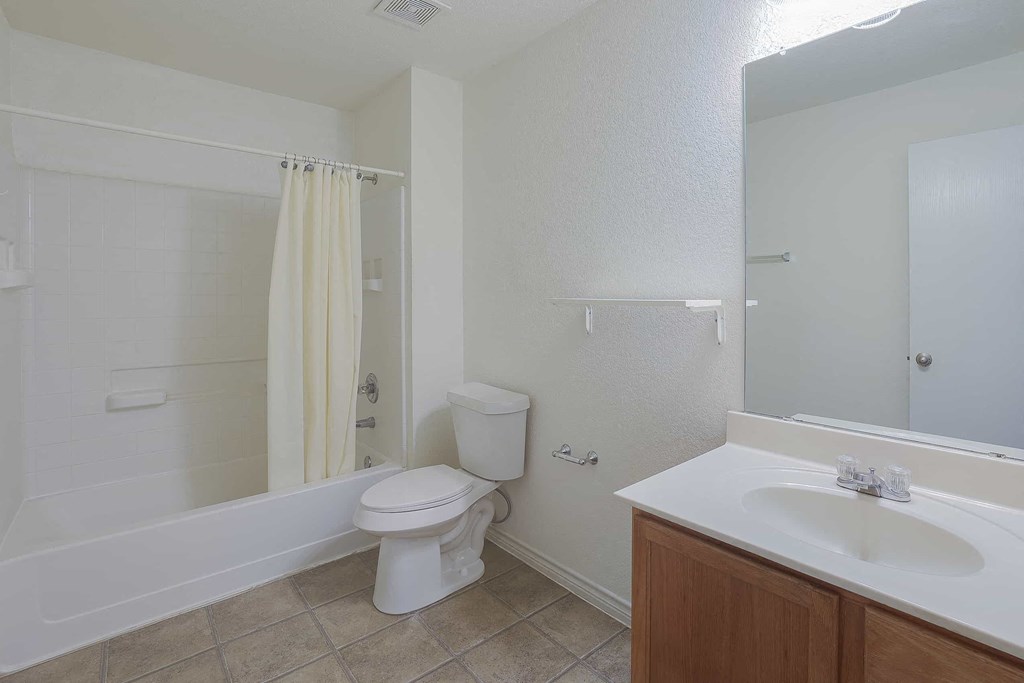 a bathroom with a toilet and a sink