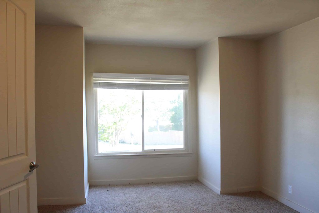 an empty room with a window in it