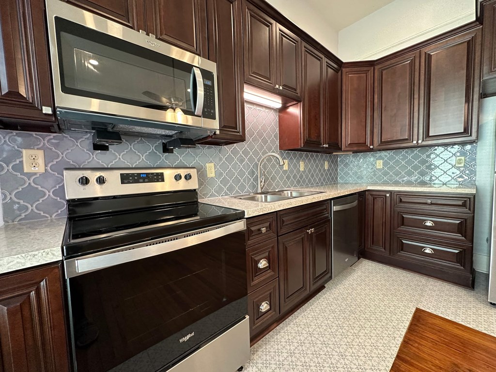 a kitchen with a stove and a microwave