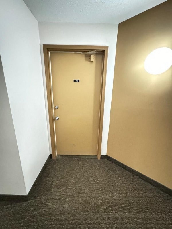 a door to a room with a white door