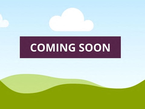 coming soon sign on the top of a hill