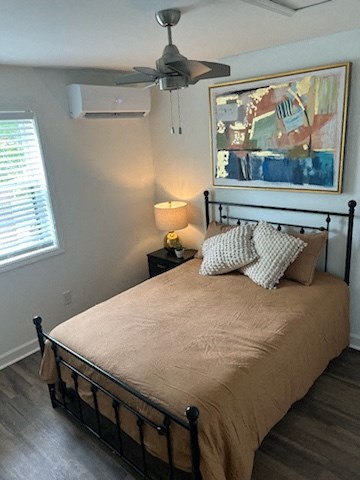 a bedroom with a bed and a ceiling fan