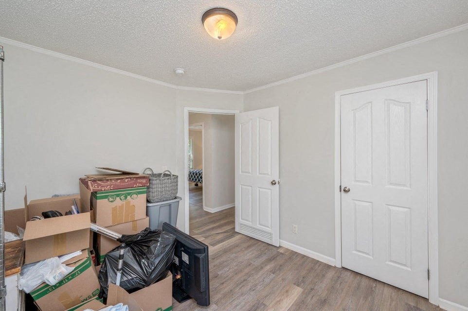the living room of a house with boxes on the floor