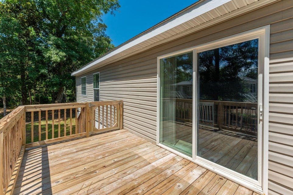 the deck of a home with a sliding glass door