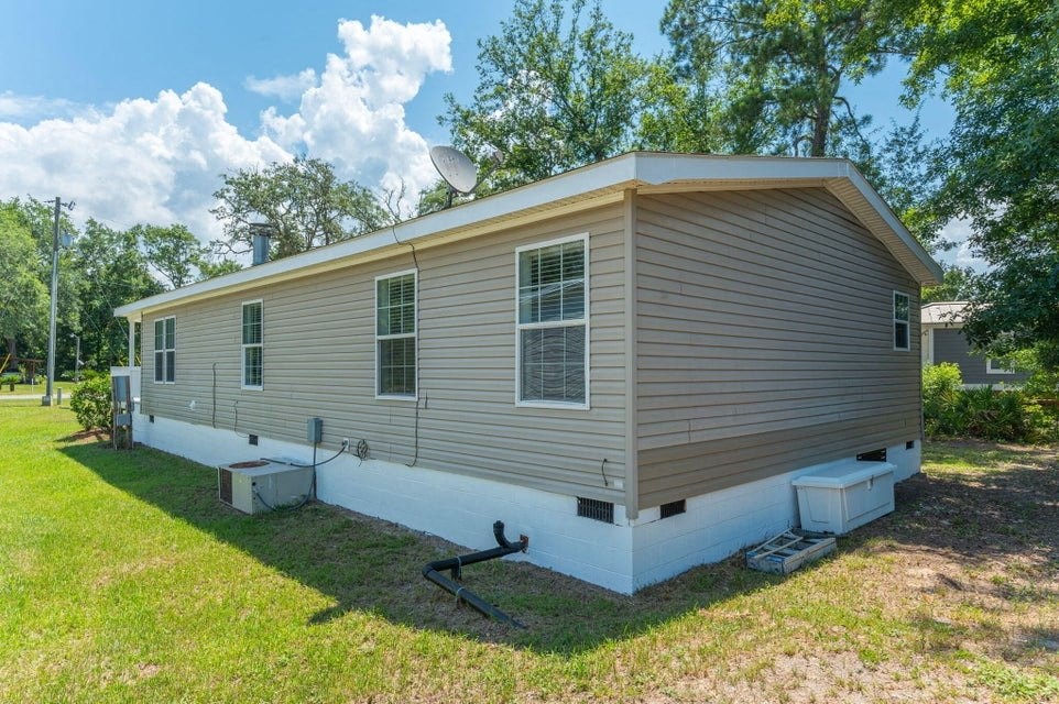 a mobile home with a satellite dish on top of it