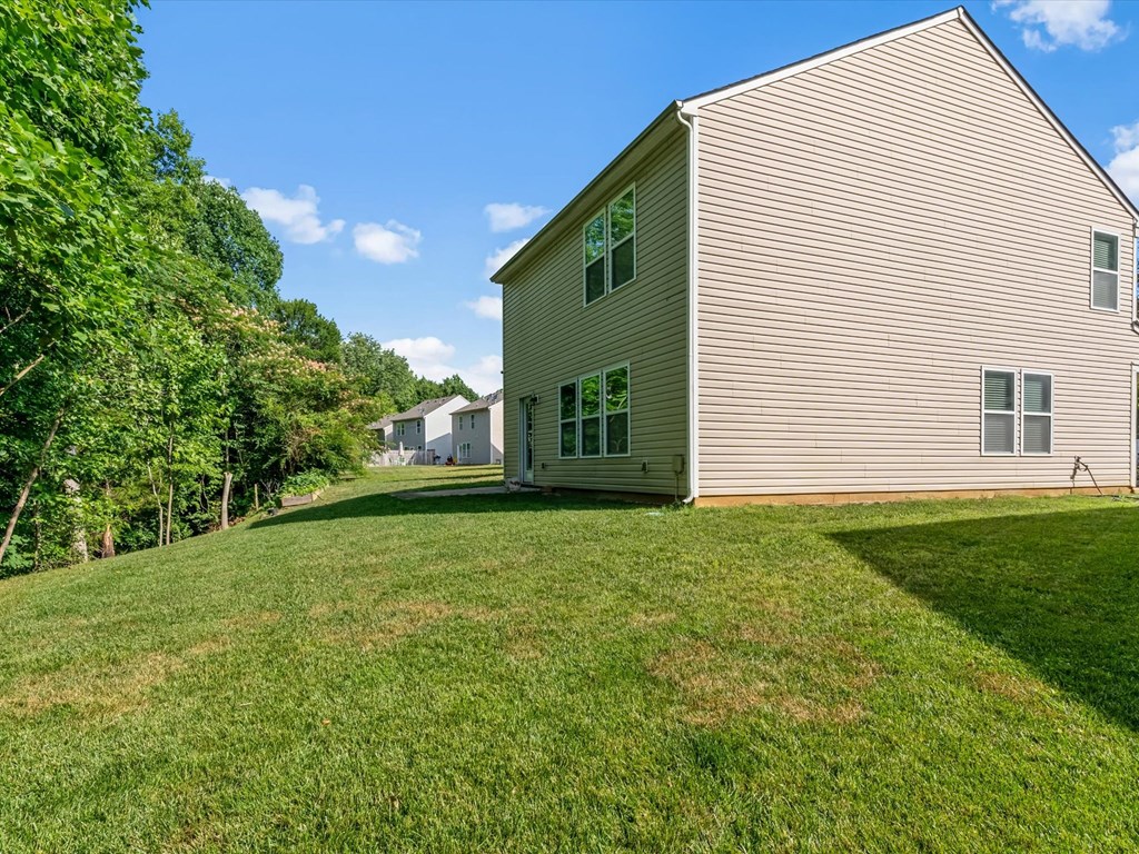 a house with a yard in front of it