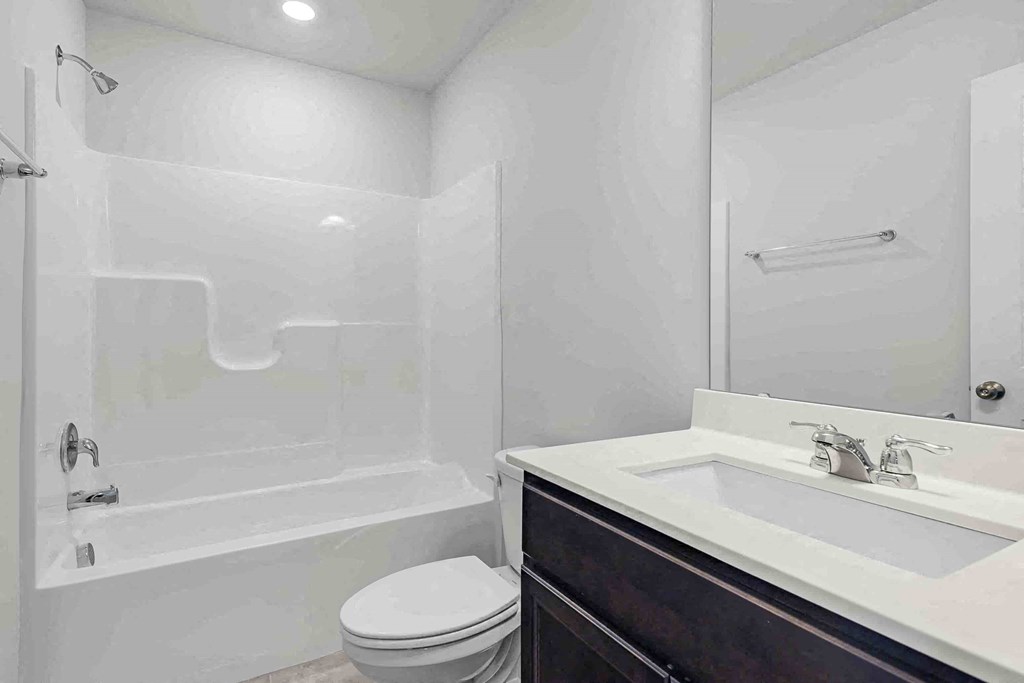 a bathroom with a sink toilet and a shower