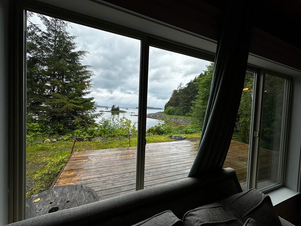 a view of the ocean from a living room window