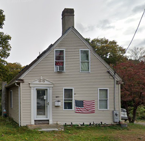 a house with an flag on the side of it