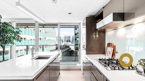 a kitchen with a sink and a stove and a window