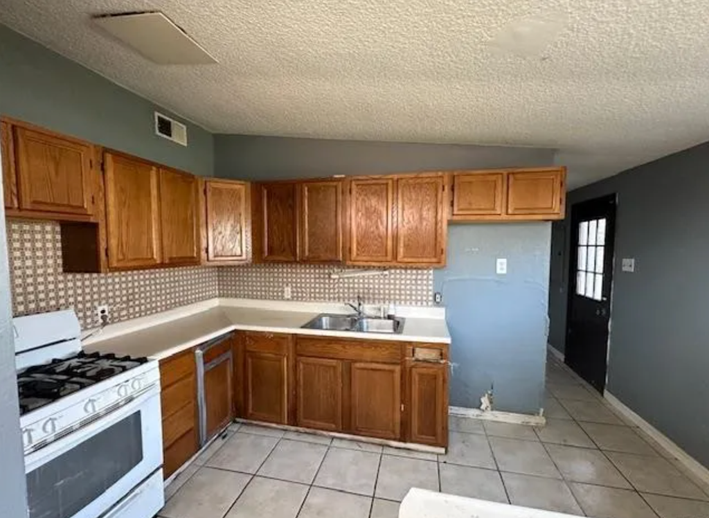 a kitchen with wooden cabinets and a stove and a refrigerator