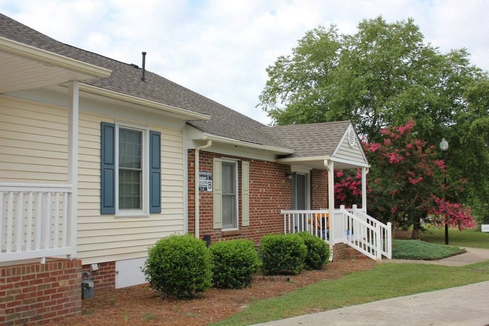 a house with a porch and a white railing