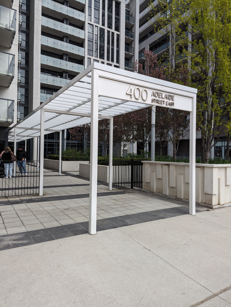 the entrance to the 400 avenue of the arts condominiums is under a canopy