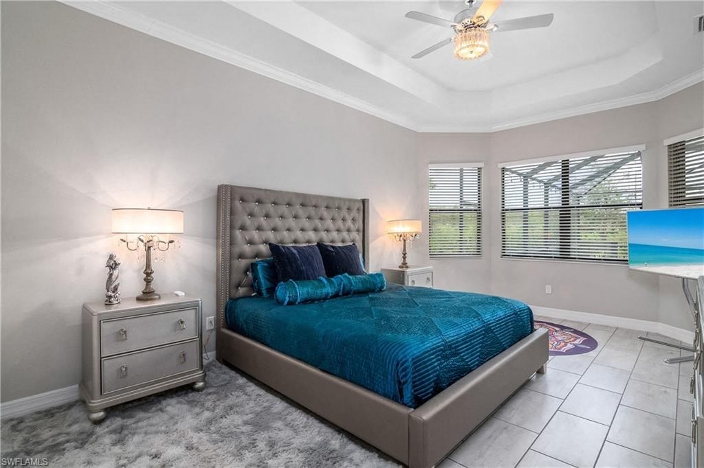 a bedroom with a bed and a ceiling fan